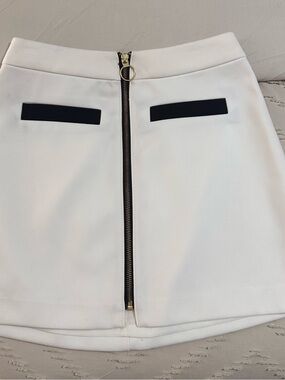 Express White Mini Skirt with Center Gold Zip and Black Pocket Accents